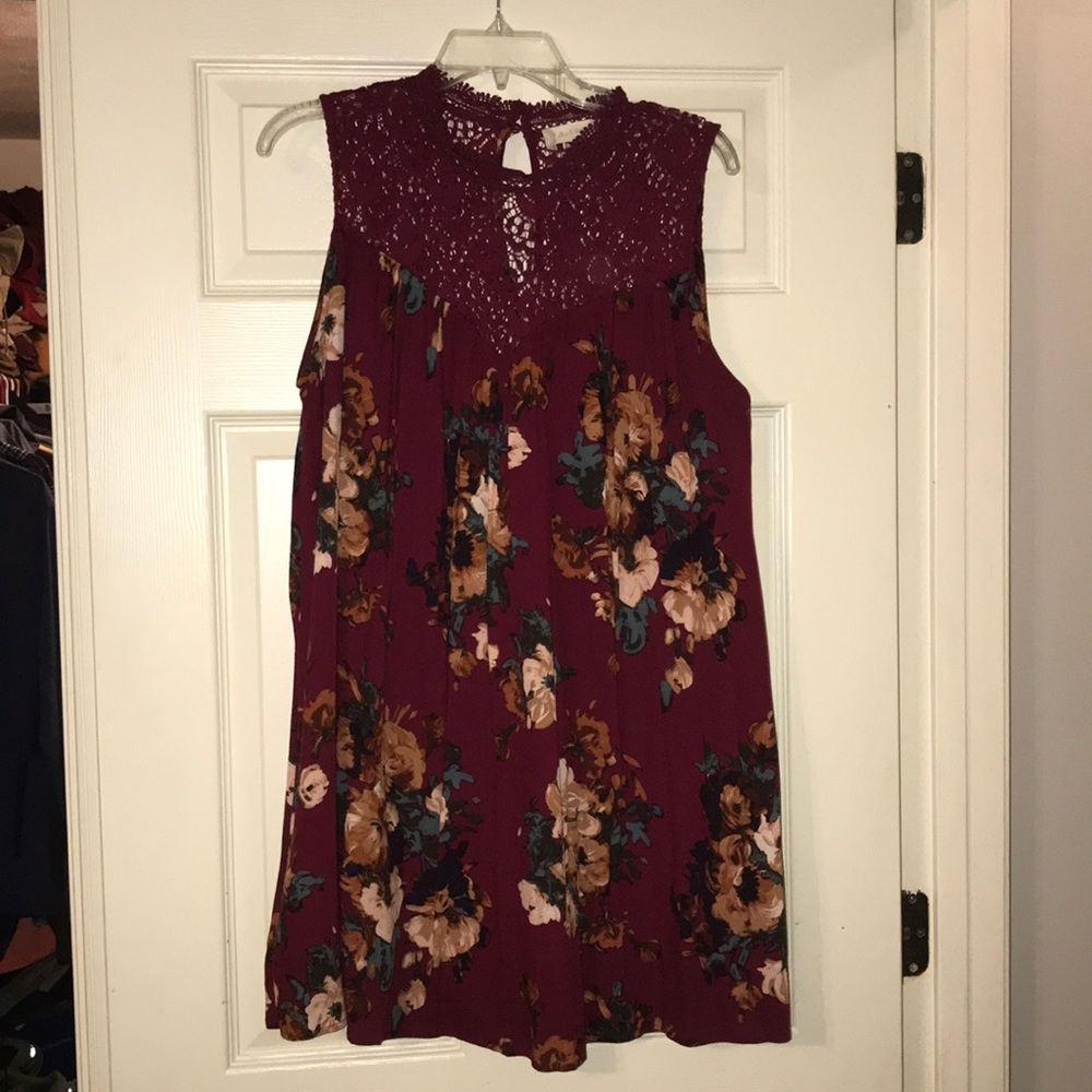 Altard State top. Wine with floral design.